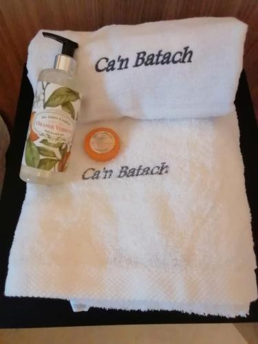 a towel with a bottle of soap on top of it at Villa Can Batach-Nueva Construcción en Sóller in Sóller