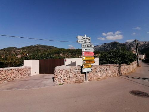 a street sign with many street signs on it at Villa Can Batach-Nueva Construcción en Sóller in Sóller
