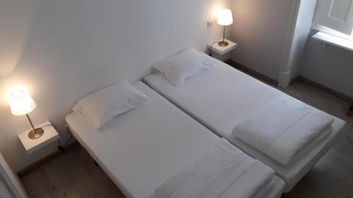 Postel nebo postele na pokoji v ubytování Hostel A Casa da Árvore