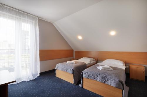 Ein Bett oder Betten in einem Zimmer der Unterkunft Hotel Wena