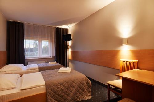 Ein Bett oder Betten in einem Zimmer der Unterkunft Hotel Wena