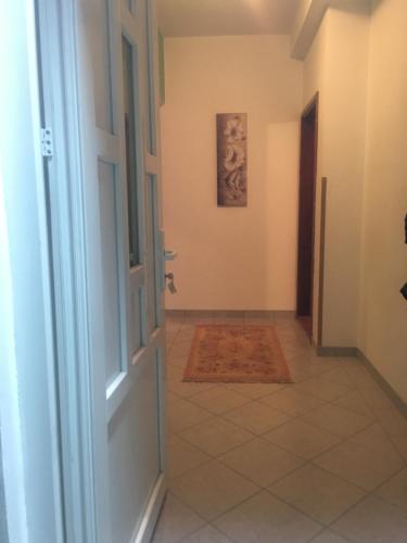 an open door to a hallway with a tile floor at Trebinje Mirjana in Trebinje