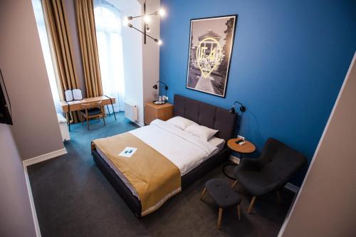 מיטה או מיטות בחדר ב-E4 Hotel