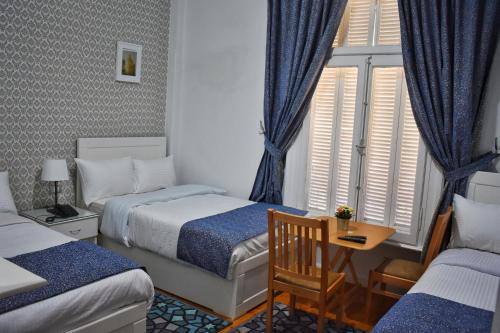 Postel nebo postele na pokoji v ubytování columbia downtown cairo