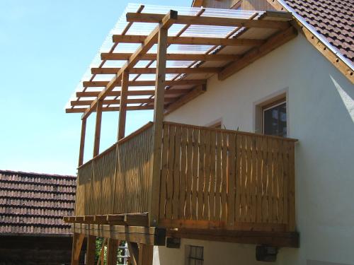 a wooden deck on the side of a house at Ferienwohnung mit Charme und Blick auf Dinkelsbühl in Dinkelsbühl
