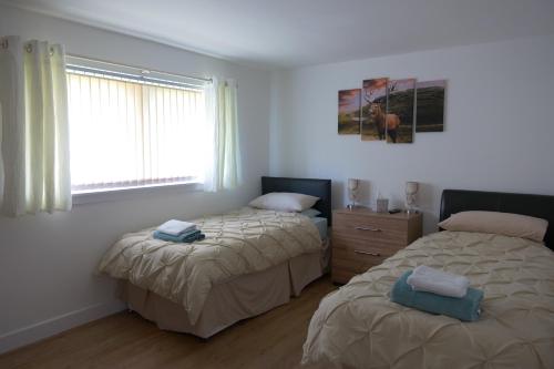 Krevet ili kreveti u jedinici u okviru objekta Kirkside Holiday Home