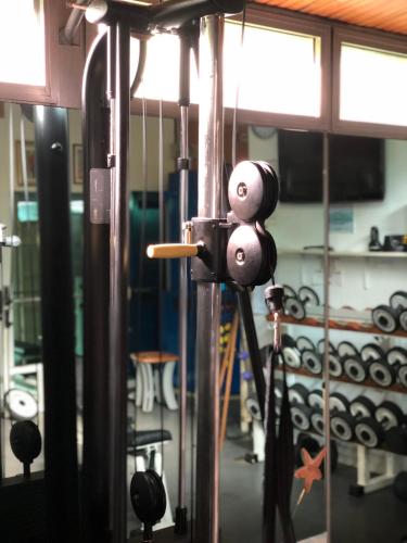 a close up of a gym with a machine at Hotel Flora in Milano Marittima