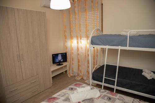 Postel nebo postele na pokoji v ubytování B&B Miramare Suite