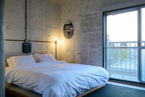 Postel nebo postele na pokoji v ubytování Rc Hotel Kyoto Yasaka