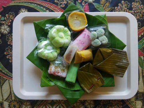a plate of food with different types of food at Doeloerkoe Homestay in Solo