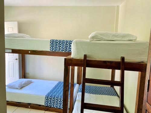 Ένα ή περισσότερα κρεβάτια σε δωμάτιο στο Hostal Casa Huasteca