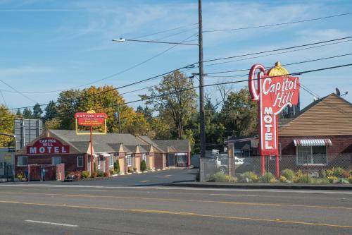a motel sign on the side of a street at Capitol Hill Motel in Portland