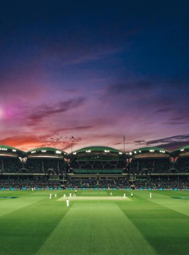 a rendering of a cricket stadium at dusk at Cosmo on Bank in Adelaide