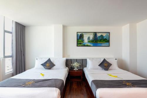 Tempat tidur dalam kamar di Tarasa Hotel