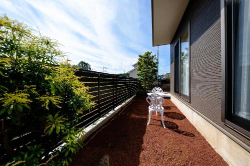 a skeleton standing on the side of a house at 21 ORIYA Mt Fuji -縁ENISHI- in Fujikawaguchiko