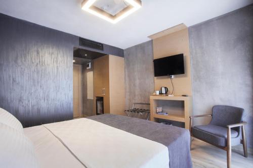 Letto o letti in una camera di Red Stone Hotel