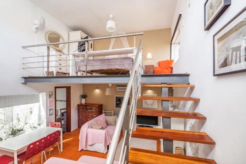 Giường trong phòng chung tại Akivillas Sesimbra Ocean