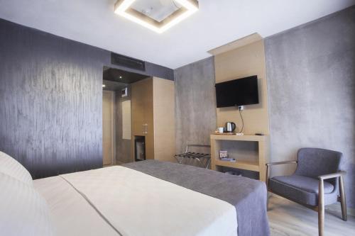 Letto o letti in una camera di Red Stone Hotel