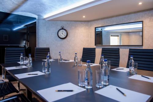 a conference room with a long table and chairs at The Lansbury Heritage Hotel & SPA By Sunday - Canary Wharf London in London