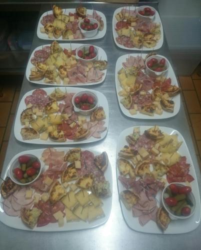 a group of plates of food on a table at Le Grand Chatelard HÔTEL BAR RESTAURANT in Sainte-Marie-de-Cuines