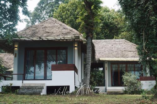 a small house with a thatched roof at Villa Allure Koh Mak in Ko Mak