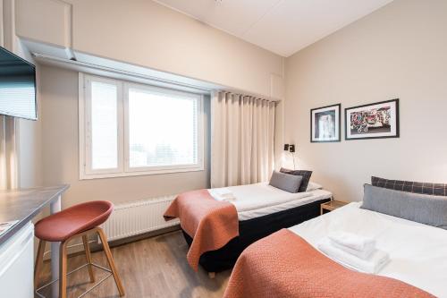 Säng eller sängar i ett rum på Forenom Aparthotel Espoo Leppävaara