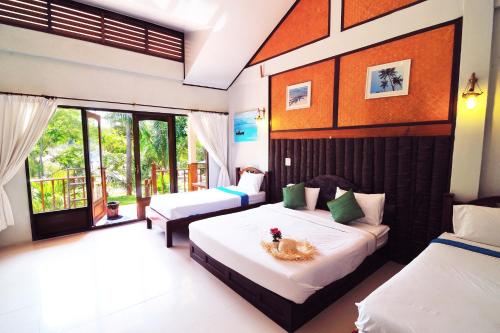 Postel nebo postele na pokoji v ubytování Koh Talu Island Resort