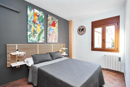 a bedroom with a king sized bed and a window at EnjoyGranada CARLOS CANO I in Granada