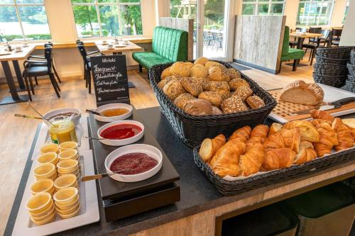 a buffet of bread and pastries on a table at Lake House Plön in Plön