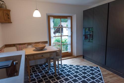 a kitchen with a table with a bowl on it at Gipfelkönig in Bayrischzell