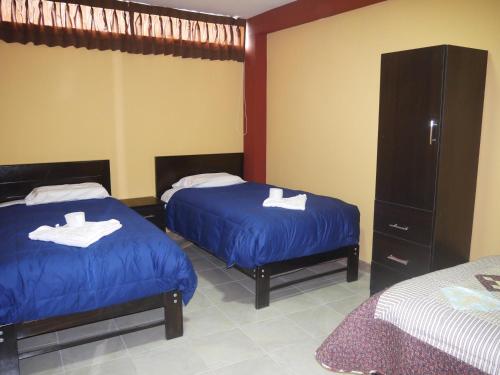 Postel nebo postele na pokoji v ubytování Hotel Suite Juliaca