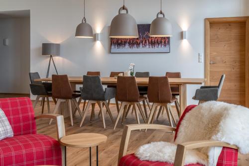 a dining room with a table and chairs at Skylodge Alpine Homes in Haus im Ennstal