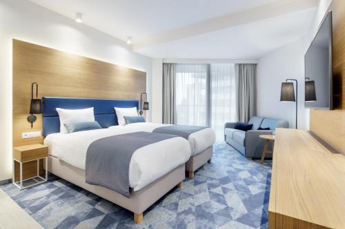 Postel nebo postele na pokoji v ubytování Seaside Park Hotel