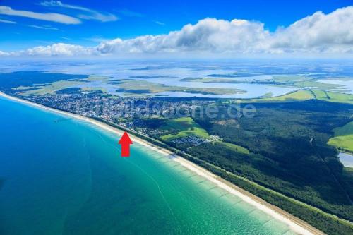 an aerial view of a beach with a red arrow at Zingster Ostseeklause in Zingst
