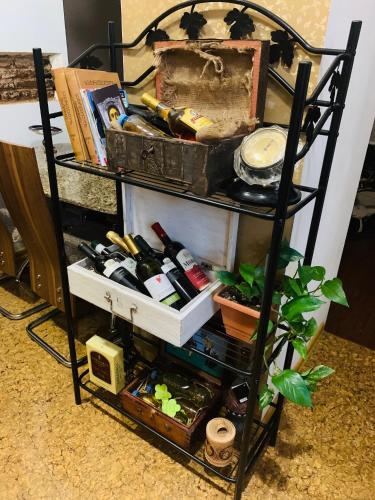 a shelf filled with lots of different items at Guest house tm in Tbilisi City