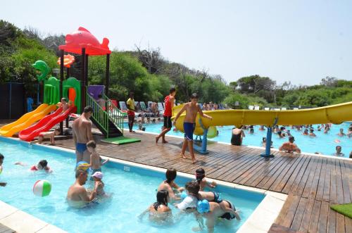 The swimming pool at or close to Happy Camp mobile homes in Camping Village Bella Sardinia