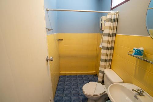 a bathroom with a toilet and a sink at Sea Garden Resort & Spa, Haadrin in Haad Rin