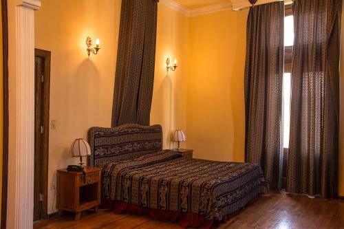 En eller flere senger på et rom på Hotel Roma