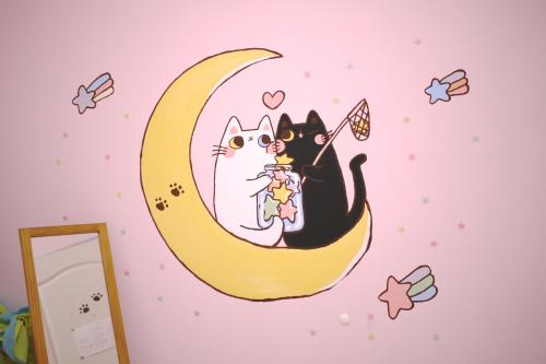 two cats sitting on the moon wall sticker at Red Letter Day in Tainan