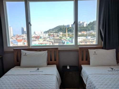 Krevet ili kreveti u jedinici u objektu Backpackers In Yeosu