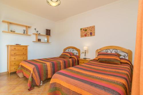 two beds sitting next to each other in a bedroom at Can Tut in Campanet