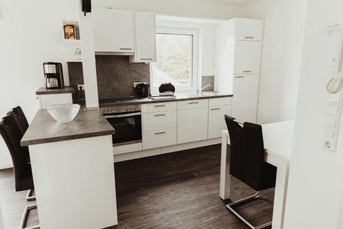 Kuchyň nebo kuchyňský kout v ubytování Apartment Strandnüst