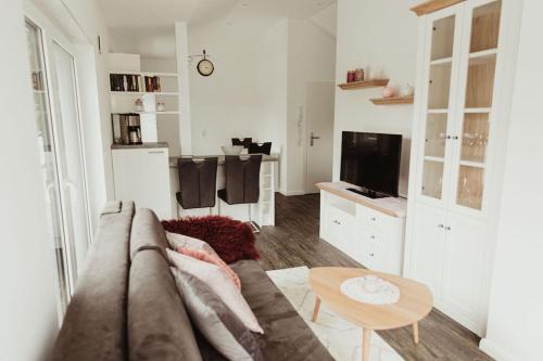 TV a/nebo společenská místnost v ubytování Apartment Strandnüst