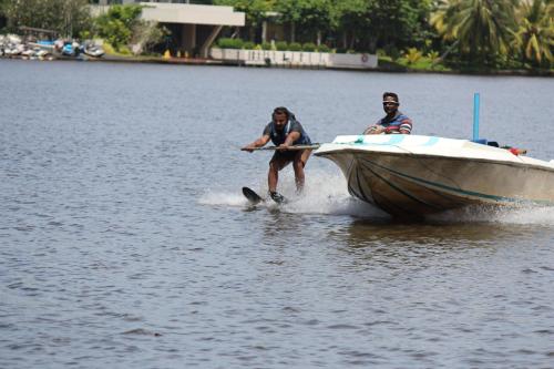 two people are on a boat in the water at Bird's Nest by Natures Bliss in Ragama