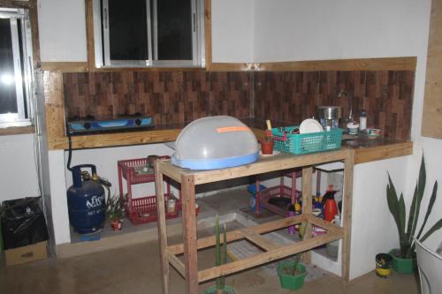 a kitchen with a counter with a mixer on a table at Maraño's Home in Legazpi