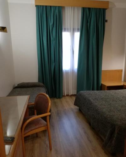 Ένα ή περισσότερα κρεβάτια σε δωμάτιο στο FILIPPONE HOTEL&RISTORANTE