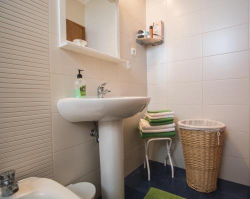 a bathroom with a sink and a toilet at Casa da Avó - Vila do Porto in Vila do Porto