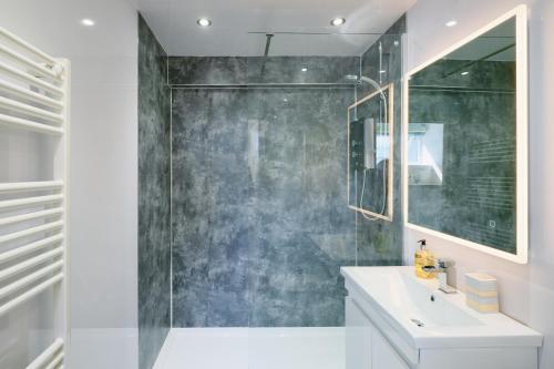 a bathroom with a sink and a glass shower at Finest Retreats - Luxury Holiday Let in Porthleven, Sleeping 2 in Porthleven