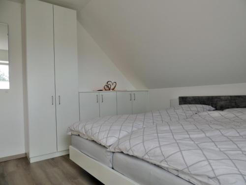 Ένα ή περισσότερα κρεβάτια σε δωμάτιο στο Ferienhaus Schomaker