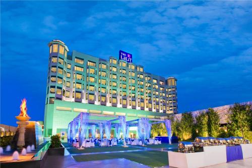 a hotel building with a gazebo in front of it at The Lalit Jaipur in Jaipur